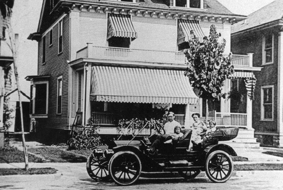 Drueke family and car in front of 120 Grand Avenue